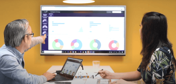 Sava team members Helen and Paul look at an early version of Sava Intelligent Energy software