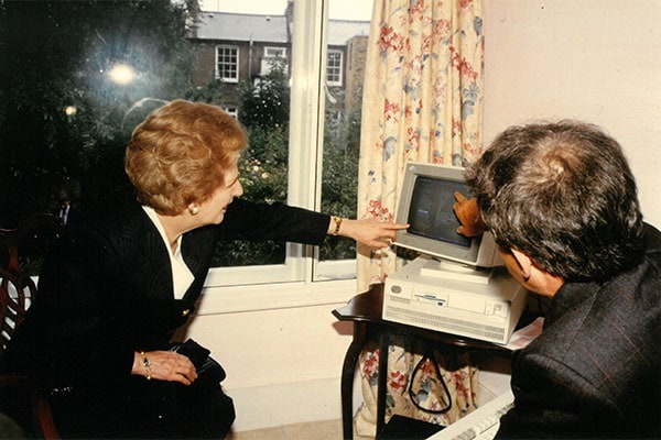 UK Prime Minister Margaret Thatcher, looking at NHER energy software developed by Sava in 1990